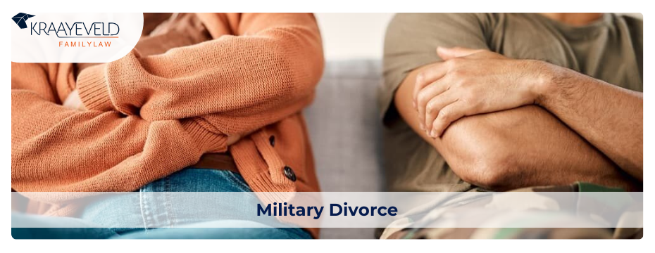 A man and woman sit together on a couch, discussing military divorce matters in Grand Rapids.